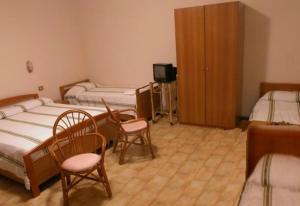 Postel nebo postele na pokoji v ubytování Albergo-Ristorante"Parco alle Noci"tra la Cascata delle Marmore,Labro e valle Santa di S Francesco