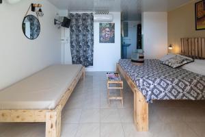 Voodi või voodid majutusasutuse Villa Sable et Colibris toas