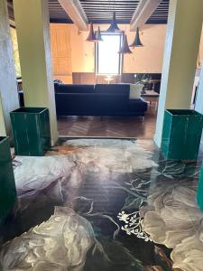 a living room with a floor covered in plastic at chambre d'hôtes Madame in Branges