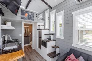 a tiny house with a kitchen and a sink at Zen Tiny Home in Apple Valley