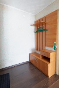 a room with a wooden cabinet and a wall at Панама in Petropavlovsk