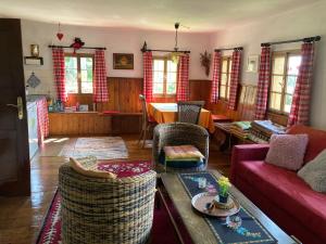 a living room with a couch and a table at Altes Bauernhaus in Gnesau +23 photos