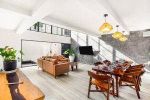 a living room with a table and a couch at Old Listing - Selva 5 in Tulum