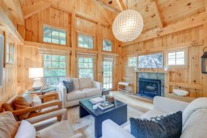 a living room with a couch and a fireplace at Peaceful Vacation Rental with Deck 5 Mi to Cashiers in Cashiers