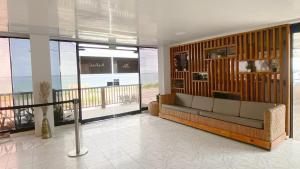 a living room with a couch and a balcony at On Vacation Blue Reef in San Andrés