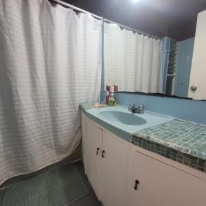 a bathroom with a sink and a mirror at The Guest House 1 at the booming center of Miraflores, Lima - Peru in Lima