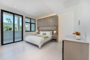 a bedroom with a bed and a large window at Aventuras Hotel in Loreto +67 photos