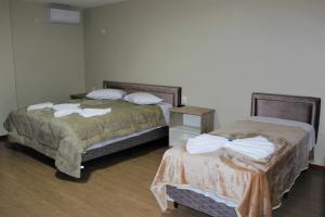 Postel nebo postele na pokoji v ubytování Pousada Essência Serrana Gramado