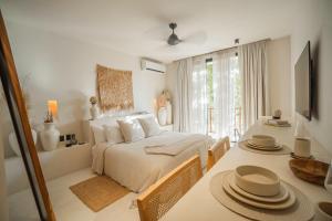 Voodi või voodid majutusasutuse Nãmas Tulum toas