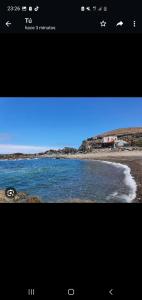 Captura de pantalla de una pantalla con una imagen de una playa en Casitas Isabelita, en Valle de Santa Inés