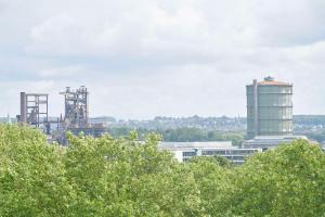 a view of a city with trees and buildings at Radisson Blu Hotel Dortmund in Dortmund