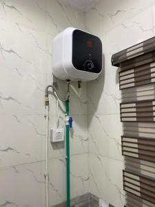 a security camera on the wall of a bathroom at Melford Homes in Lagos