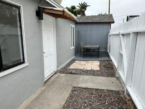 a door to a house with a table and a patio at Beachside 2BR close 2 sand, town in Laguna Beach