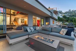 a living room with a couch and a fireplace at 6MIL 5BR Sunset Strip Villa Jetliner Views Oasis in Los Angeles