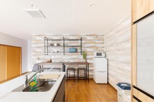 Een keuken of kitchenette bij Oimazato大今里民泊