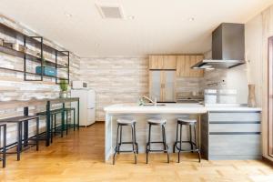 Een keuken of kitchenette bij Oimazato大今里民泊