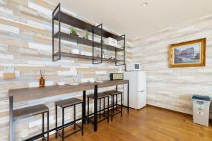 Een keuken of kitchenette bij Oimazato大今里民泊