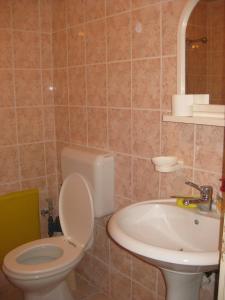 Koupelna v ubytování Liberta Apartment + 7 fotografií