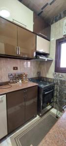 a kitchen with a stove and an oven in it at Sweet home 1 in Mansoura