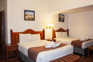 Letto o letti in una camera di Hotel Amerinka