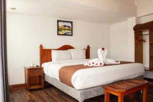 Letto o letti in una camera di Hotel Amerinka