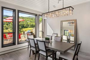 a dining room with a table and chairs at Homestead Townhome in Snowmass Village