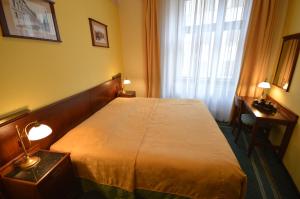 Postel nebo postele na pokoji v ubytování Grandhotel Garni