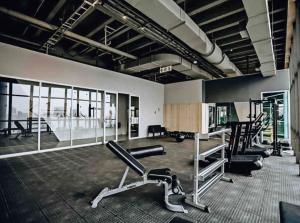 a gym with treadmills and machines in a room at Skyline Serenade in Johannesburg