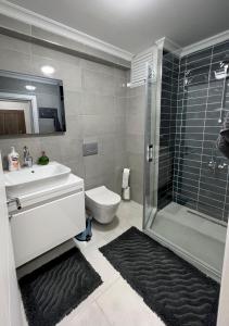 a bathroom with a sink toilet and a shower at NEW Citrus Garden Home Duplex in Mudanya