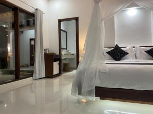 Letto o letti in una camera di Namika Villas Ubud