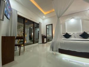 Letto o letti in una camera di Namika Villas Ubud