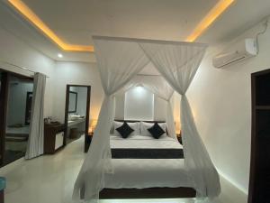 Letto o letti in una camera di Namika Villas Ubud