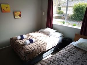 Postel nebo postele na pokoji v ubytování Mt Dobson Motel