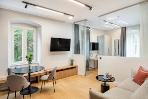 a living room with a couch and a table at MAROEN 3 Lux Apartment Old Town in Split