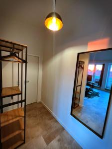 a room with a mirror on the wall at Talgarten Penthouse 1 in Erfurt