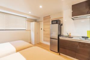 Kitchen o kitchenette sa 谷町君・星Hotel・道頓福居