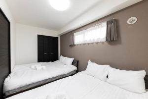 札幌市にあるEstrellaのベッド2台が隣同士に設置された部屋です。