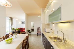 a kitchen with a sink and a counter top at Amigo Comfort Apartments in Split
