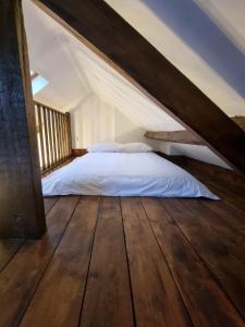 a bedroom with a bed in a attic at The Forge Kington St Michael in Chippenham