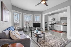 a living room with a couch and a table at Navarre Apartments in Des Moines