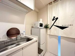 Köök või kööginurk majutusasutuses 「久HISASHI」八号店・池下OPEN【ジブリパークまで30分・最寄駅徒歩3分・名古屋駅電車9分】