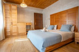 Postel nebo postele na pokoji v ubytování Hotel Restaurant Alpet Theth