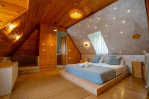 Postel nebo postele na pokoji v ubytování Hotel Restaurant Alpet Theth