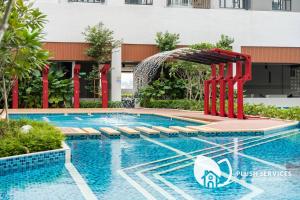 a pool at a hotel with a water slide at Sentral Suites by Plush in Kuala Lumpur