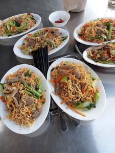 a group of plates of food on a table at The River Home in Nhơn Trạch