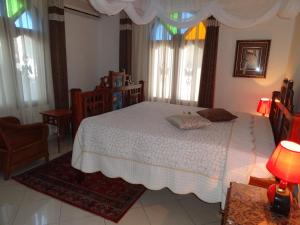 Rúm í herbergi á Al-Minar Hotel