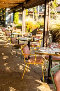 a row of tables and chairs on a patio at Ultimate Provence Hotel & Spa in La Garde-Freinet