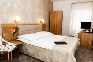 Posteľ alebo postele v izbe v ubytovaní Tulip Hotels - Wroclaw Patio