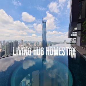 a swimming pool on the roof of a building with the shinning hud house at Infinity Pool Suite Bukit Bintang Lalaport BBCC Kuala Lumpur in Kuala Lumpur