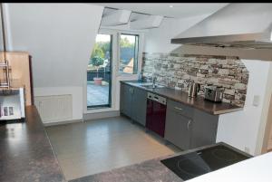 a kitchen with a sink and a counter top at Unter den Sternen in Bottrop